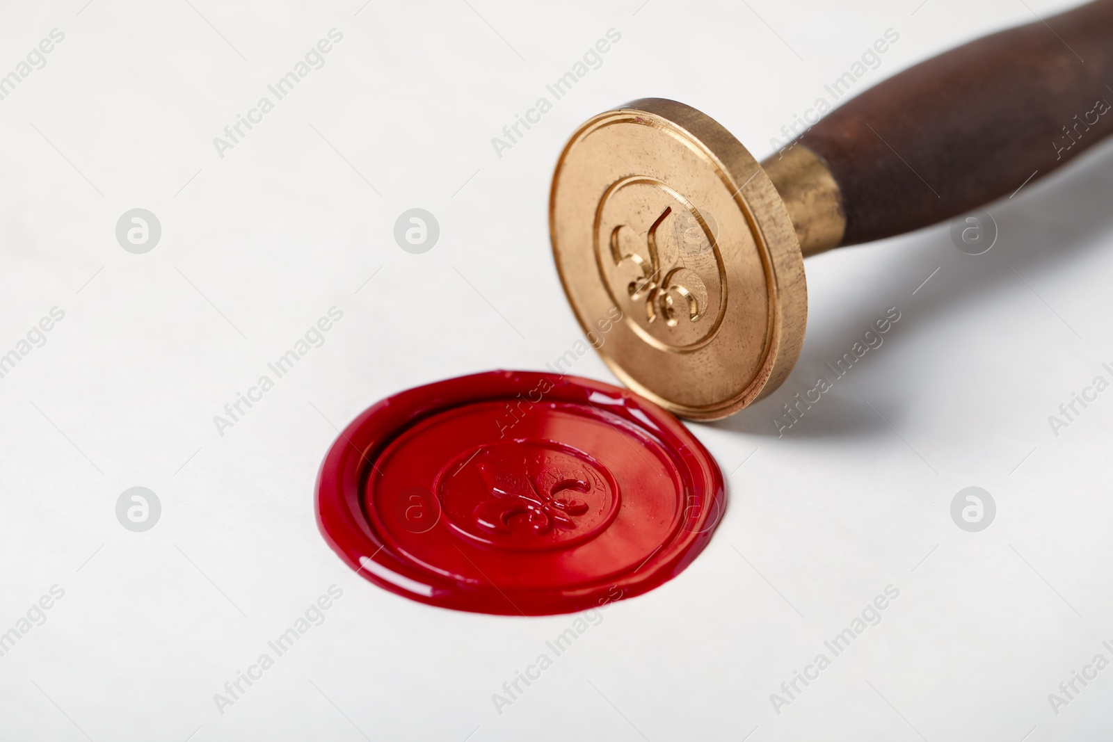 Beautiful wax stamp and red seal on paper, closeup Photo of Beautiful wax stamp and red seal on paper, closeup