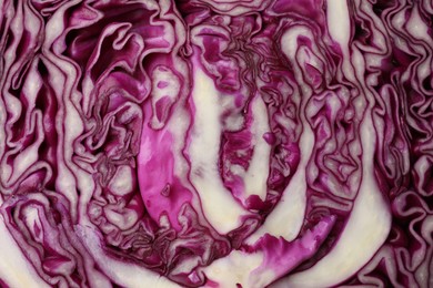 Photo of Cut fresh red cabbage as background, closeup