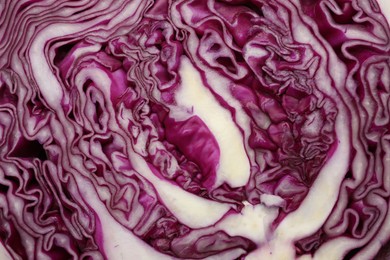 Photo of Cut fresh red cabbage as background, closeup