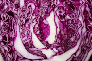 Photo of Cut fresh red cabbage as background, closeup