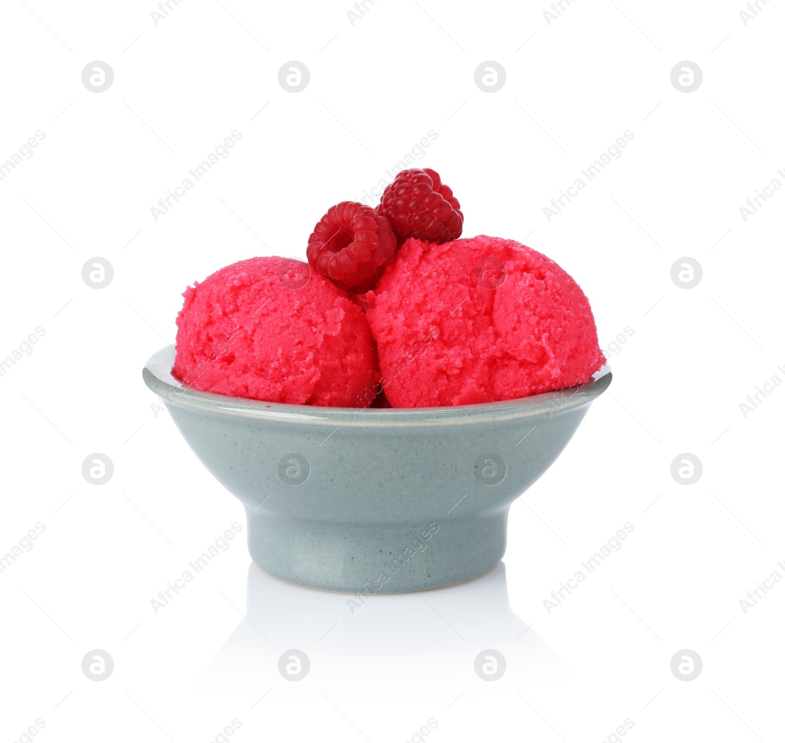 Photo of Delicious raspberry sorbet with fresh berries in bowl isolated on white