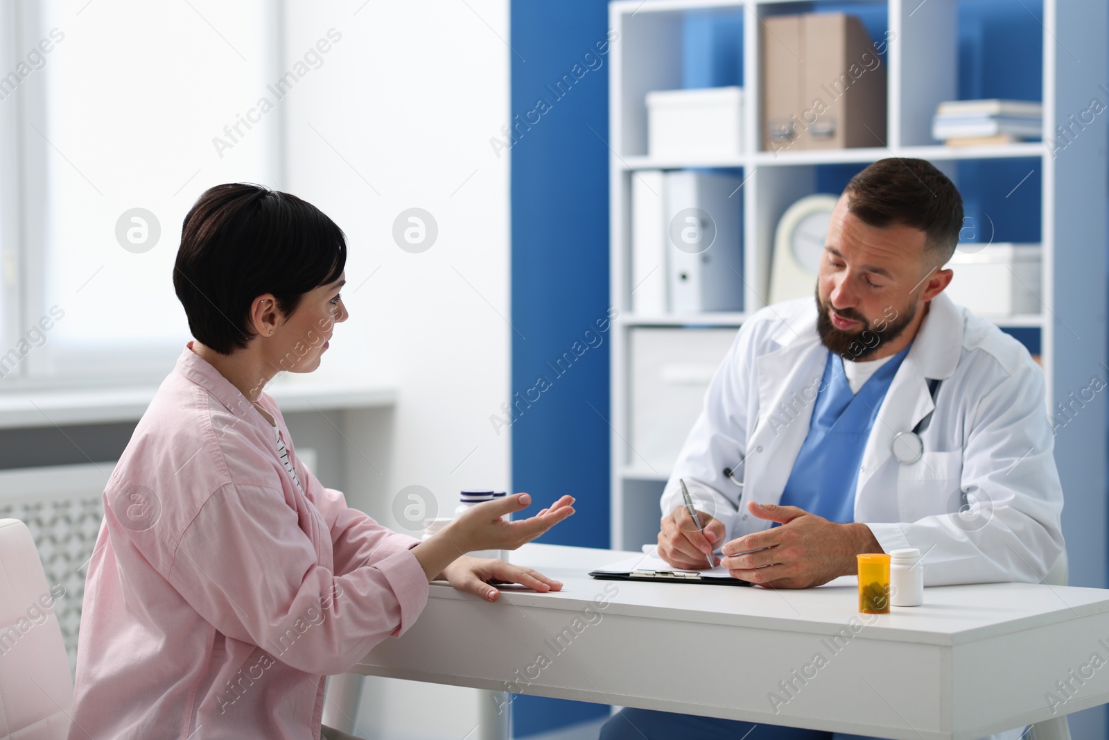 Photo of Woman having appointment with gastroenterologist in clinic