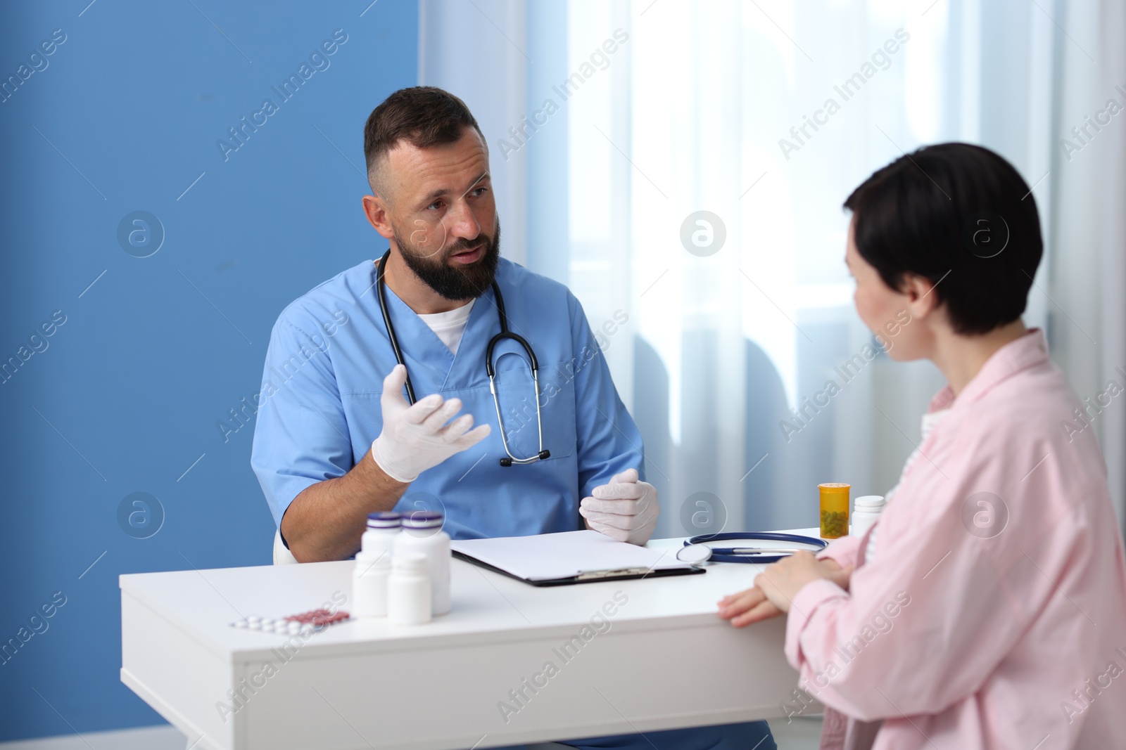Photo of Woman having appointment with gastroenterologist in clinic