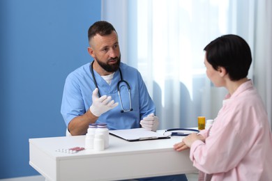 Photo of Woman having appointment with gastroenterologist in clinic