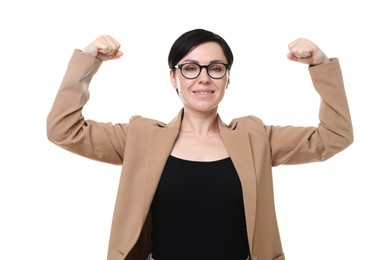 Photo of Strength. Smiling businesswoman in glasses and suit showing her biceps on white background