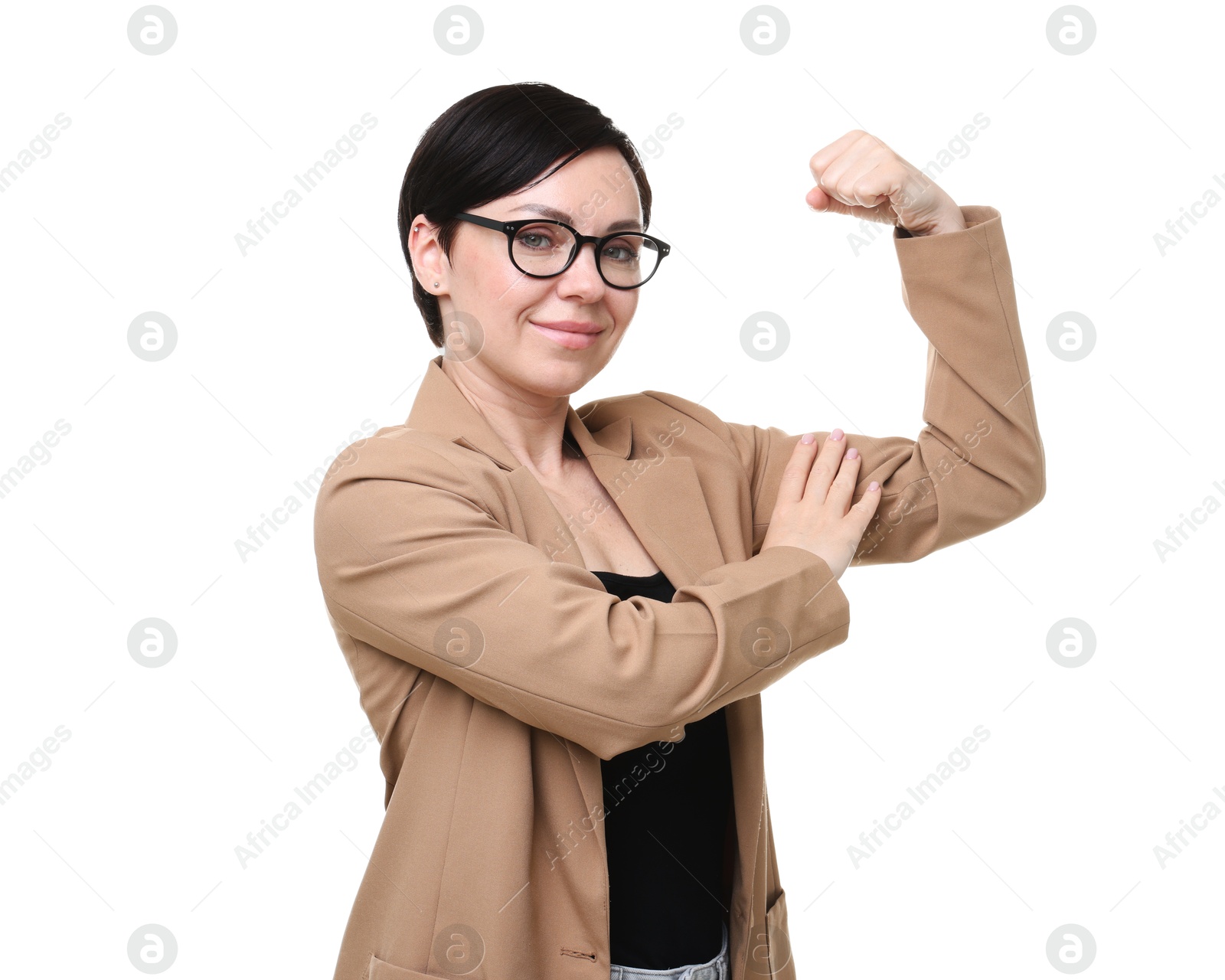 Photo of Strength. Beautiful businesswoman in glasses and suit showing her biceps on white background