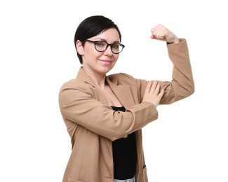 Photo of Strength. Beautiful businesswoman in glasses and suit showing her biceps on white background
