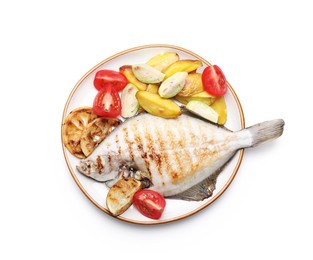 Photo of Tasty roasted flounder fish with potatoes, tomatoes and lemon slices isolated on white, top view. Homemade seafood dish