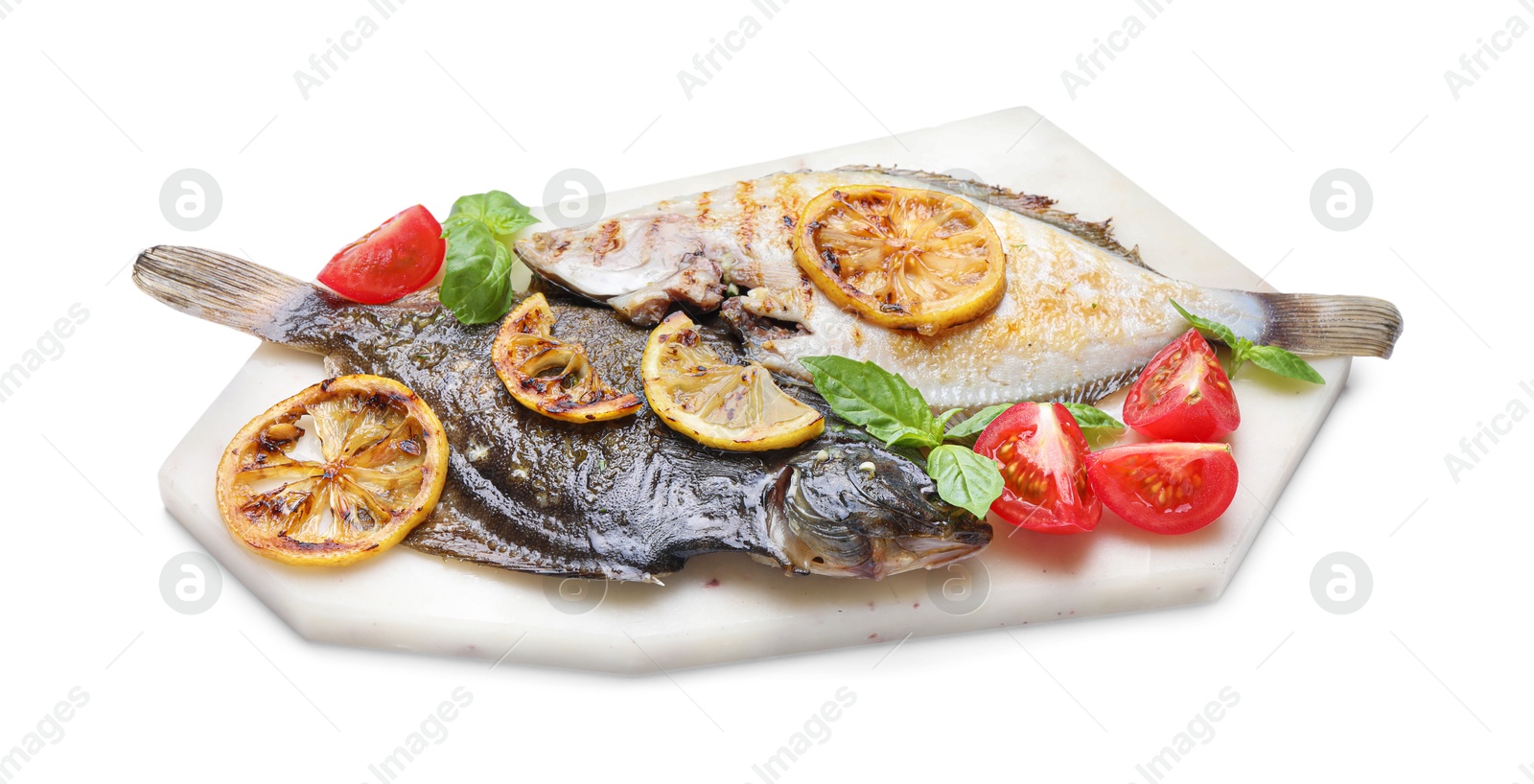 Photo of Tasty roasted flounder fish with tomatoes, basil and lemon slices isolated on white. Homemade seafood dish