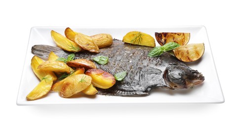 Photo of Tasty roasted flounder fish with potatoes, basil and lemon slices isolated on white. Homemade seafood dish