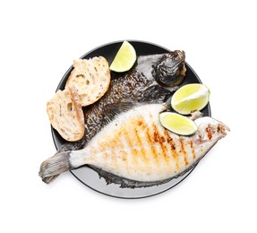 Photo of Tasty roasted flounder fish with bread and lime slices isolated on white, top view. Homemade seafood dish
