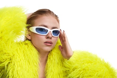 Photo of Beautiful woman in stylish sunglasses and fur coat posing on white background