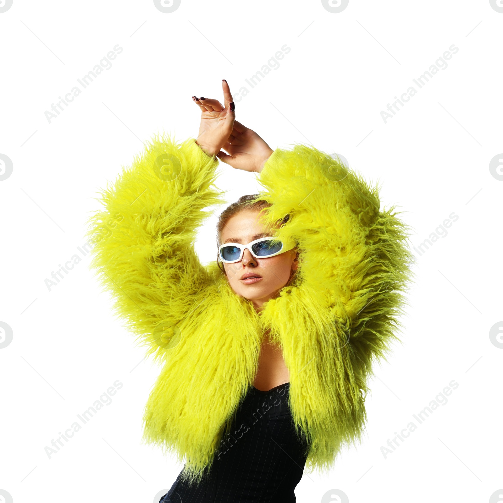 Photo of Beautiful woman in stylish sunglasses and fur coat posing on white background