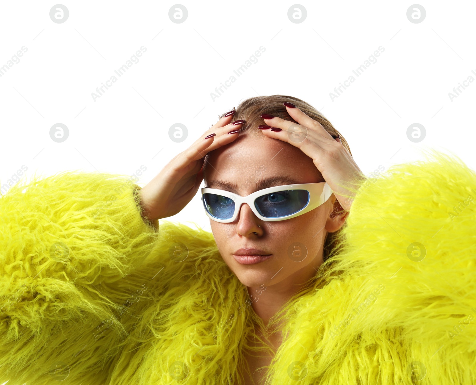 Beautiful woman in stylish sunglasses and fur coat posing on white background Photo of Beautiful woman in stylish sunglasses and fur coat posing on white background