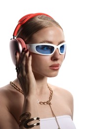 Photo of Beautiful woman in stylish sunglasses, bijouterie and headphones listening to music on white background