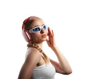 Photo of Fashionable portrait of beautiful woman in stylish sunglasses, bijouterie and headphones listening to music on white background