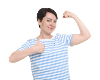 Photo of Strength. Beautiful woman showing her biceps and thumbs up on white background