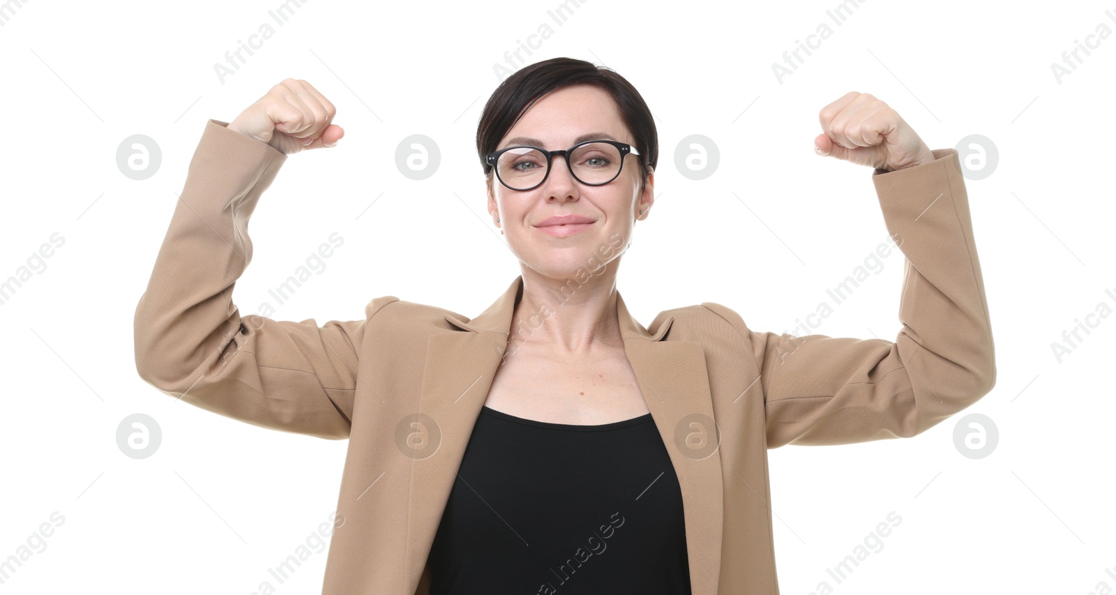 Photo of Strength. Beautiful businesswoman in glasses and suit showing her biceps on white background