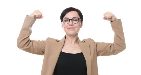 Photo of Strength. Beautiful businesswoman in glasses and suit showing her biceps on white background