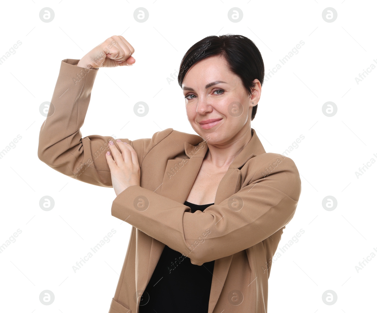 Photo of Strength. Beautiful businesswoman in suit showing her biceps on white background
