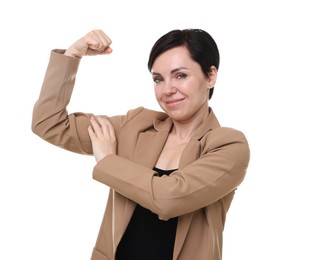 Photo of Strength. Beautiful businesswoman in suit showing her biceps on white background
