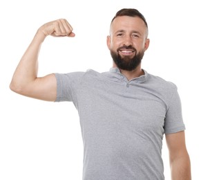 Photo of Strength. Smiling man showing his biceps on white background