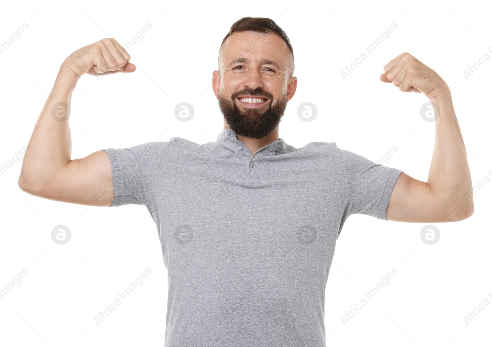 Photo of Strength. Smiling man showing his biceps on white background