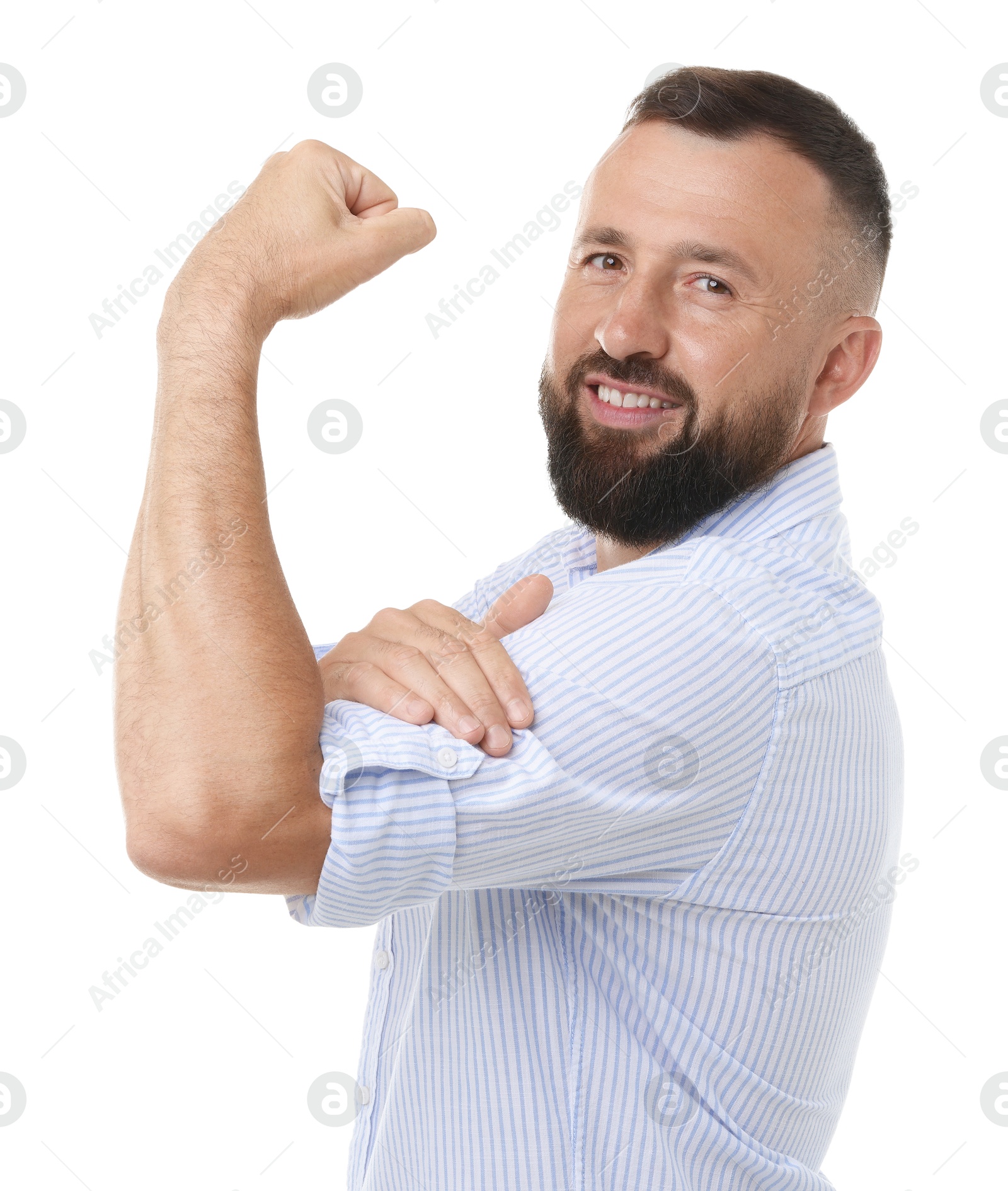 Photo of Strength. Smiling man showing his biceps on white background