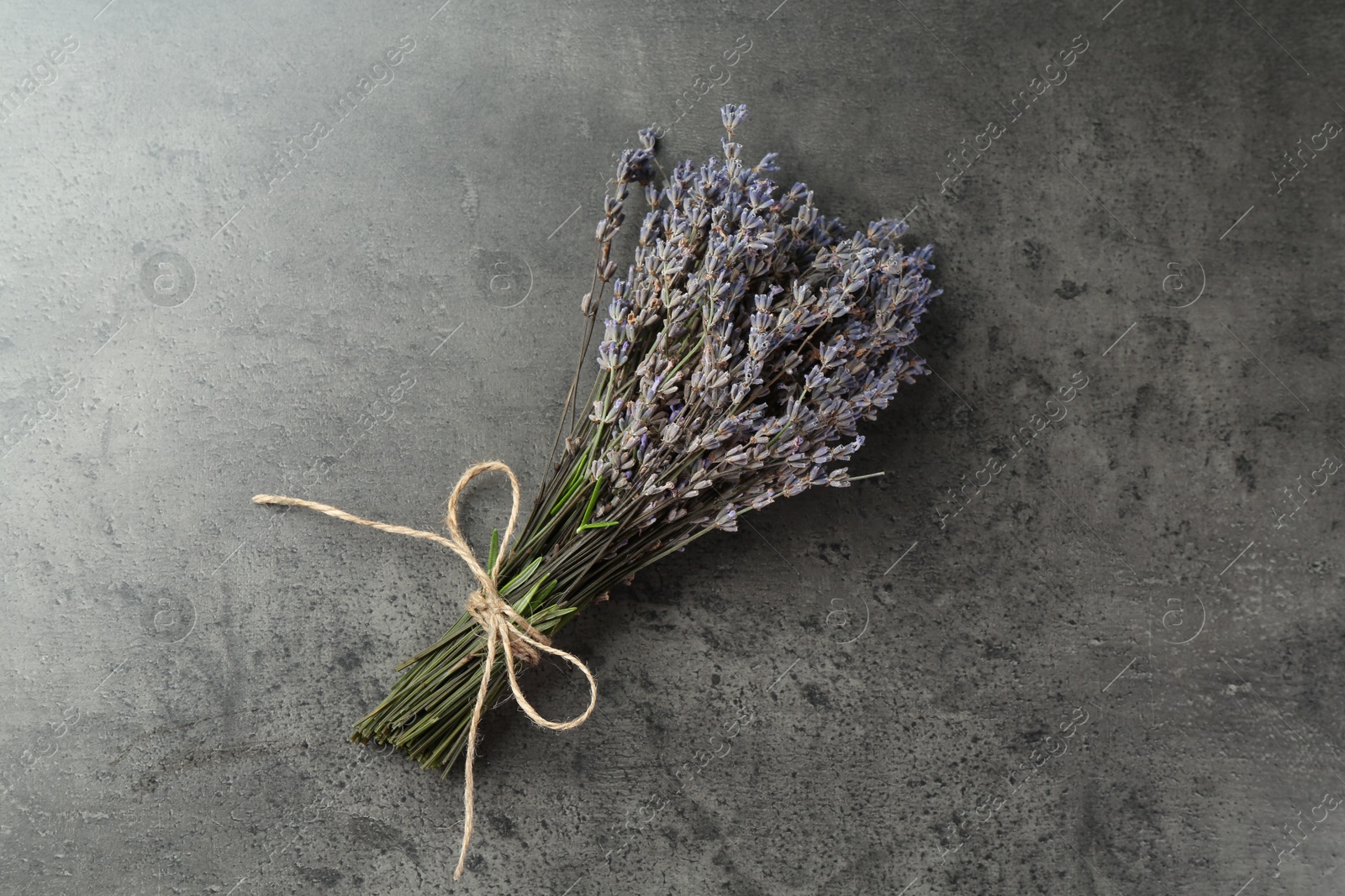 Bunch of fragrant lavender flowers on grey table, top view Photo of Bunch of fragrant lavender flowers on grey table, top view