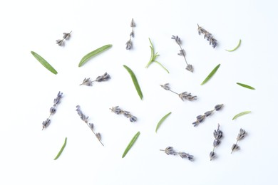 Photo of Fragrant lavender flowers and green leaves on white background, flat lay