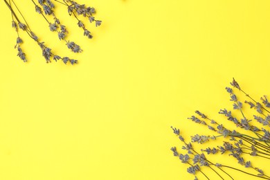 Photo of Fragrant lavender flowers on yellow background, flat lay. Space for text