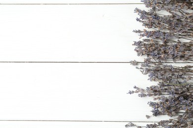 Photo of Fragrant lavender flowers on white wooden table, flat lay. Space for text