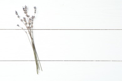 Photo of Fragrant lavender flowers on white wooden table, flat lay. Space for text