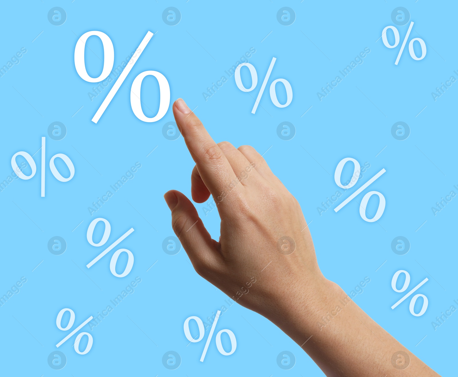 Woman touching virtual percent sign against light blue background, closeup Image of Woman touching virtual percent sign against light blue background, closeup
