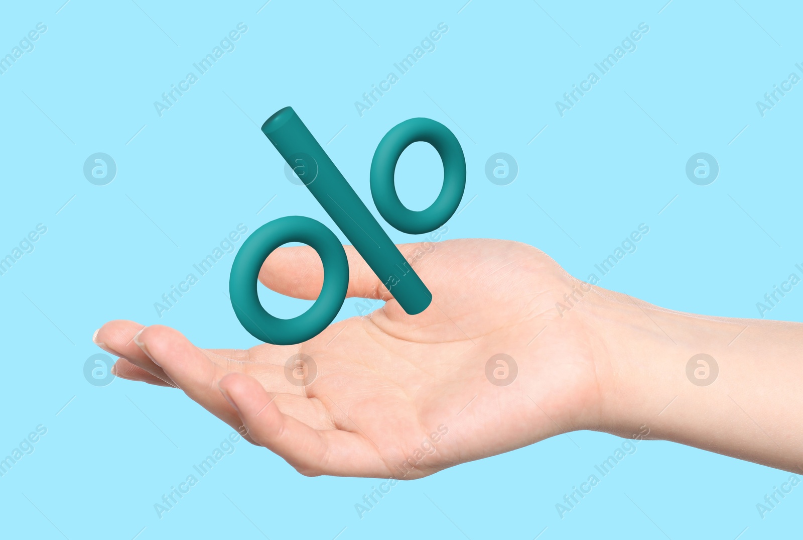 Woman holding virtual percent sign against light blue background, closeup Image of Woman holding virtual percent sign against light blue background, closeup
