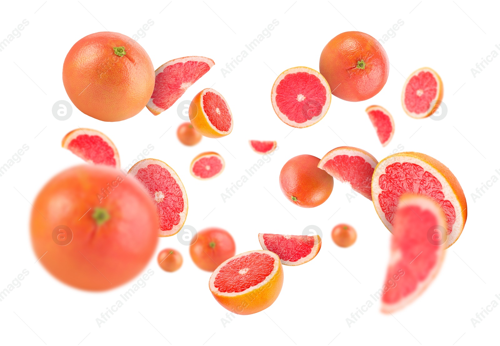 Image of Fresh grapefruits swirling in air against white background
