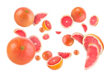 Image of Fresh grapefruits swirling in air against white background