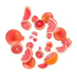 Image of Fresh grapefruits swirling in air against white background