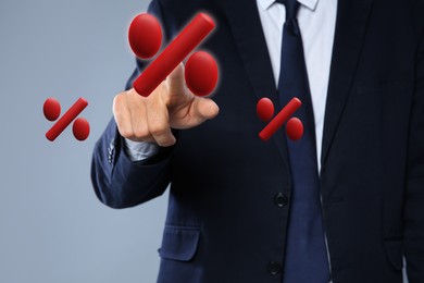 Image of Businessman touching virtual percent sign against grey background, closeup