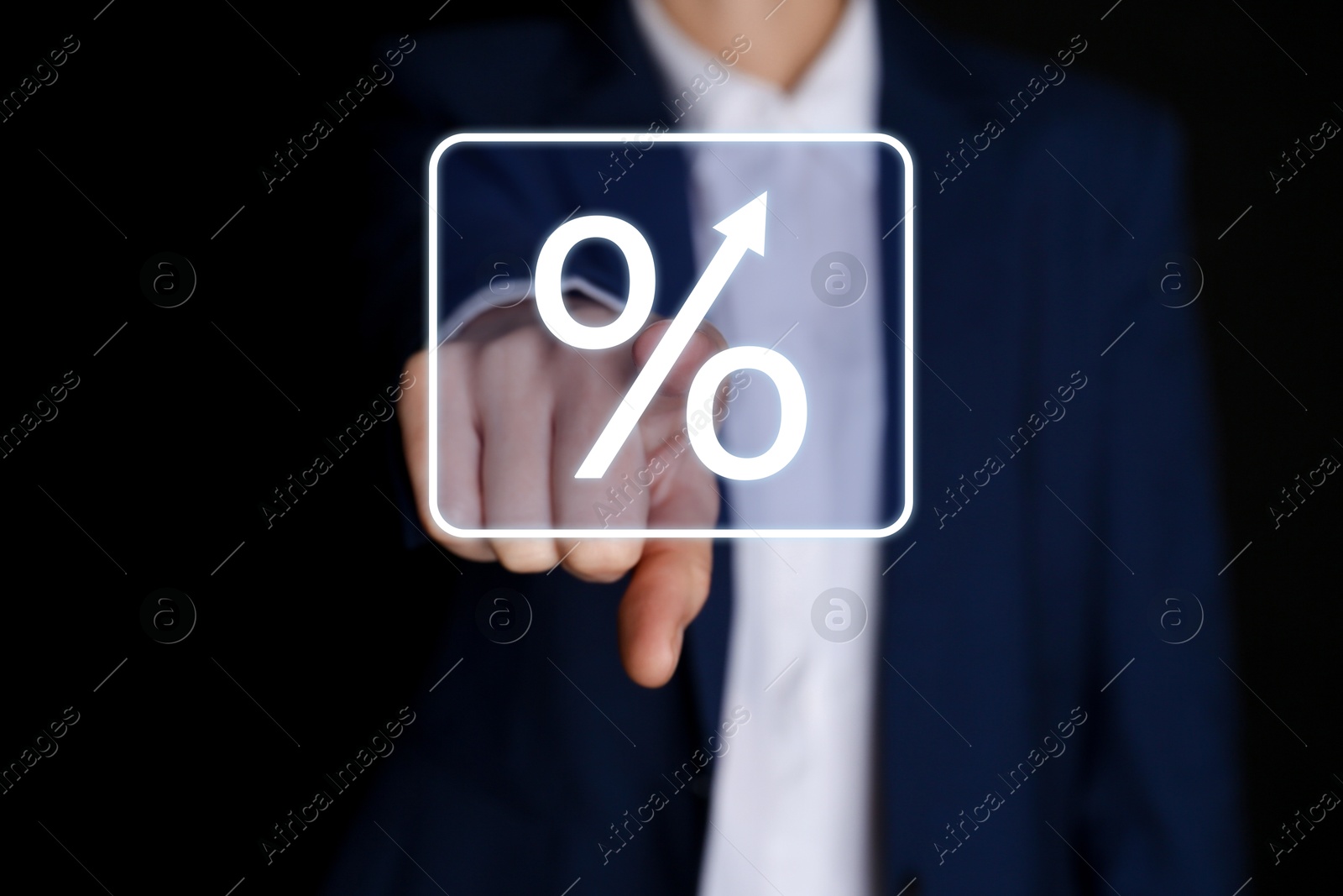 Businessman touching percent sign on virtual screen against black background, closeup Image of Businessman touching percent sign on virtual screen against black background, closeup