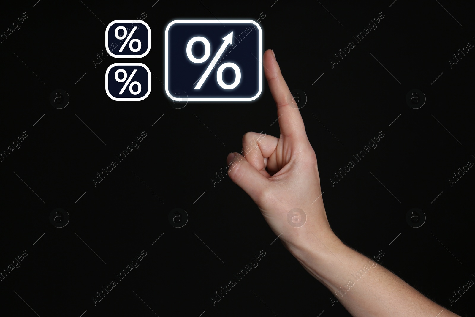 Woman touching virtual percent sign against black background, closeup Image of Woman touching virtual percent sign against black background, closeup