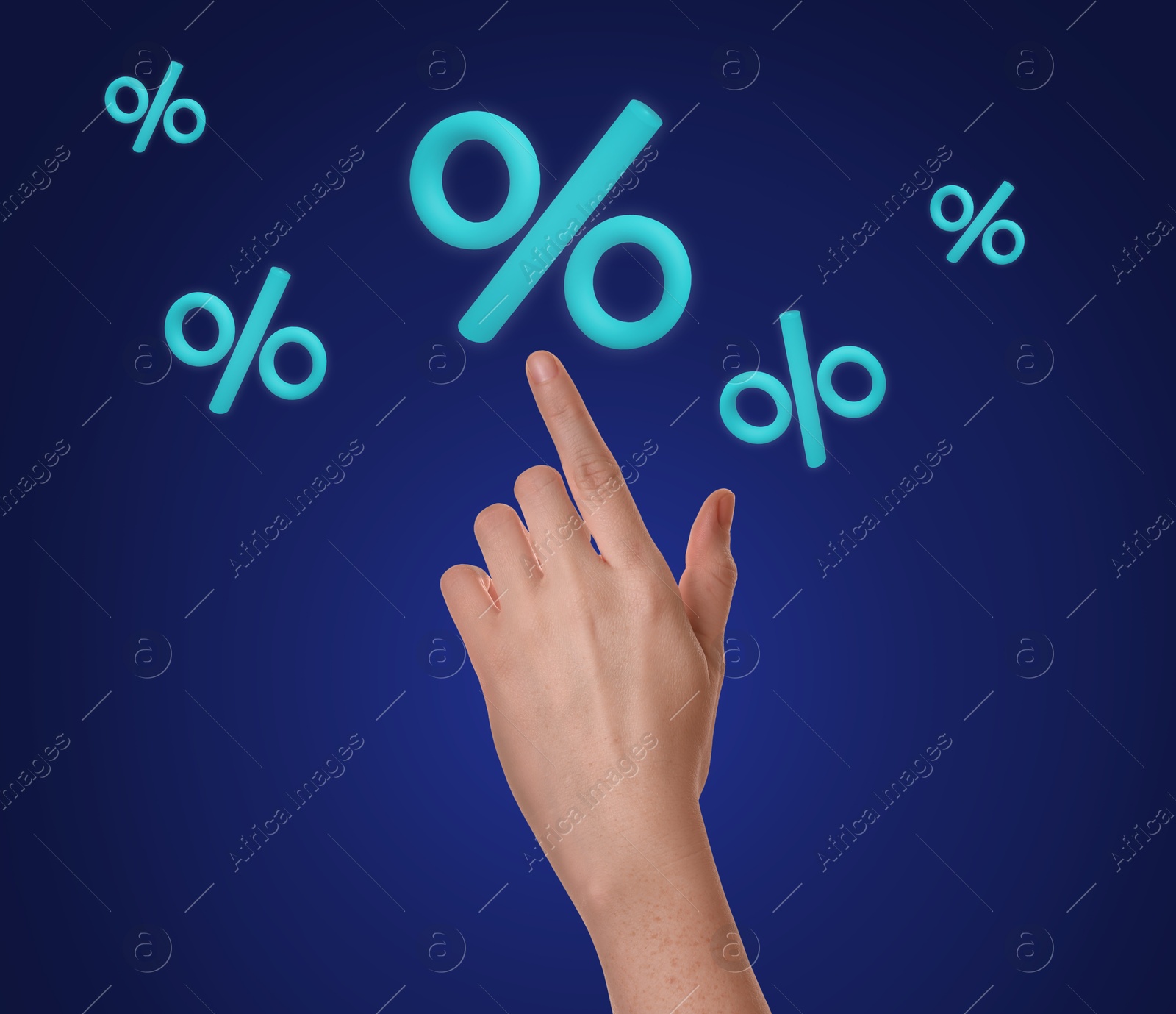 Woman touching virtual percent sign against dark blue background, closeup Image of Woman touching virtual percent sign against dark blue background, closeup