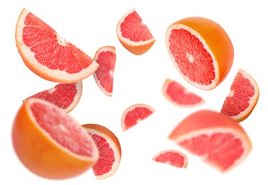 Image of Fresh grapefruits swirling in air against white background