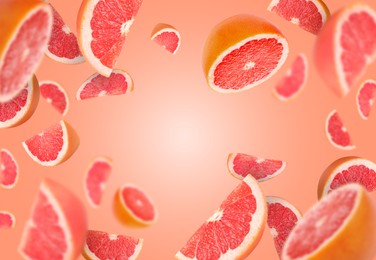 Image of Fresh grapefruits swirling in air against coral background