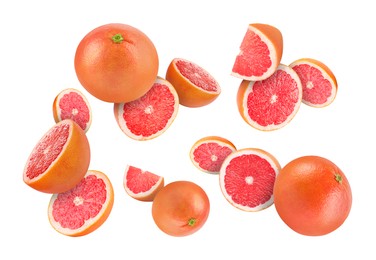 Image of Fresh grapefruits swirling in air against white background