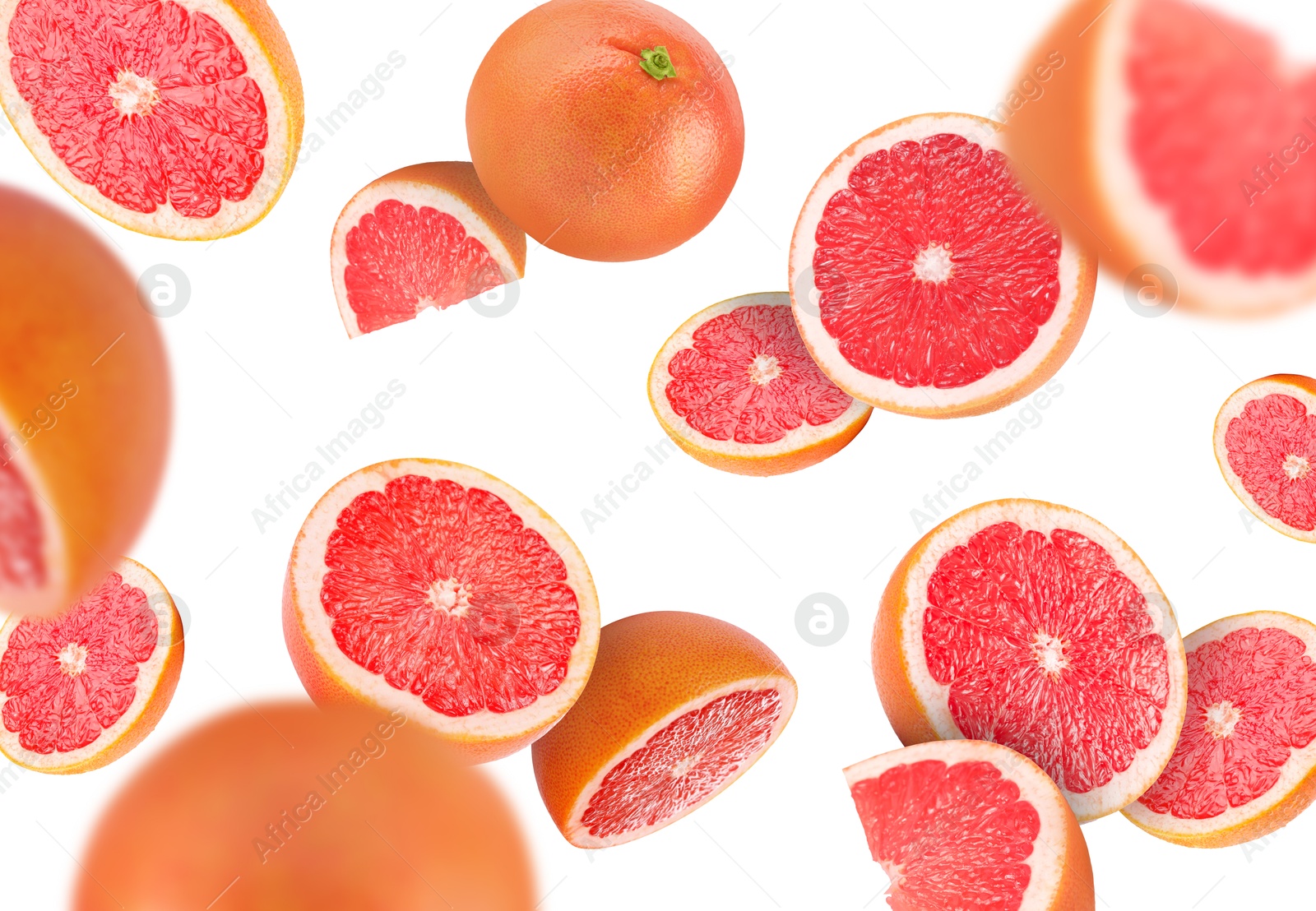 Image of Fresh grapefruits swirling in air against white background