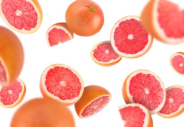 Image of Fresh grapefruits swirling in air against white background