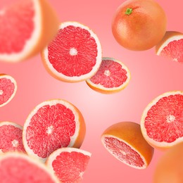 Image of Fresh grapefruits swirling in air against pink background