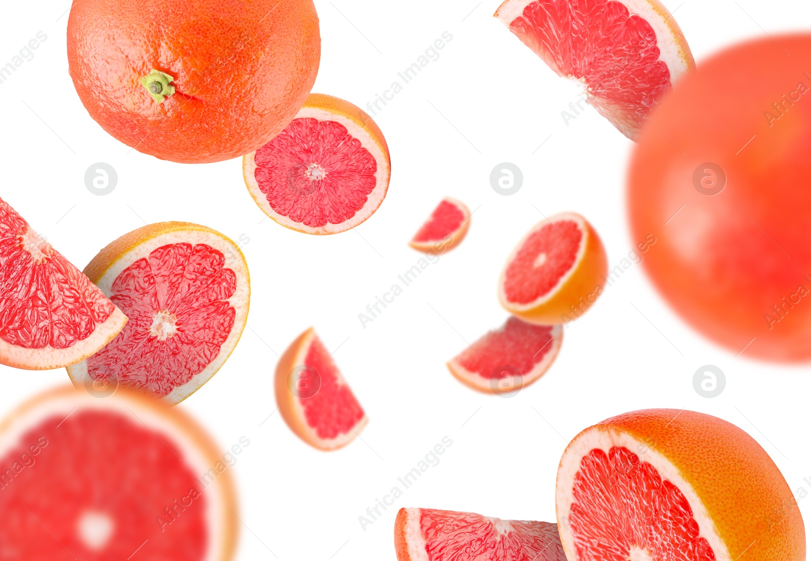 Image of Fresh grapefruits swirling in air against white background
