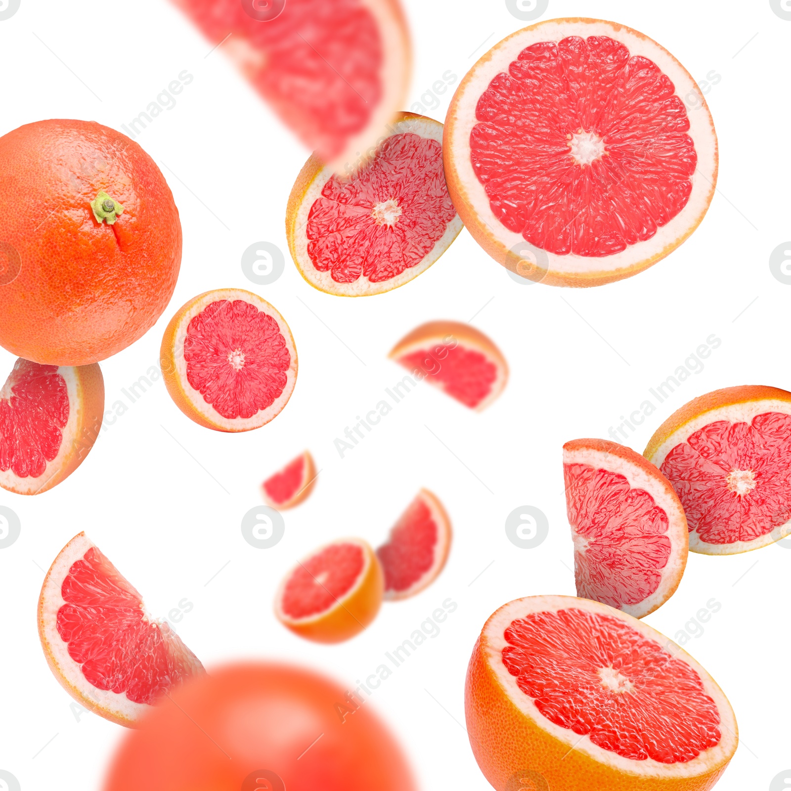 Image of Fresh grapefruits swirling in air against white background